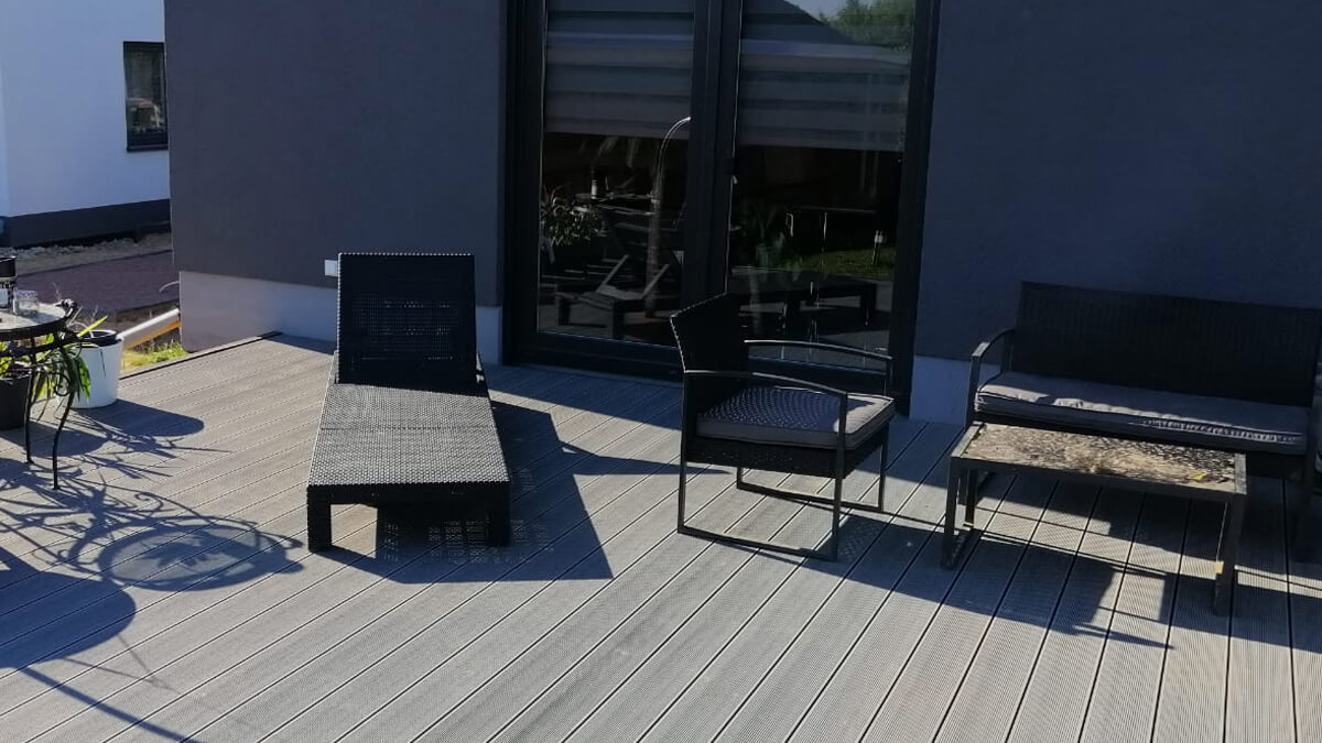 A house with a terrace – composite decking boards Standard Light Gray