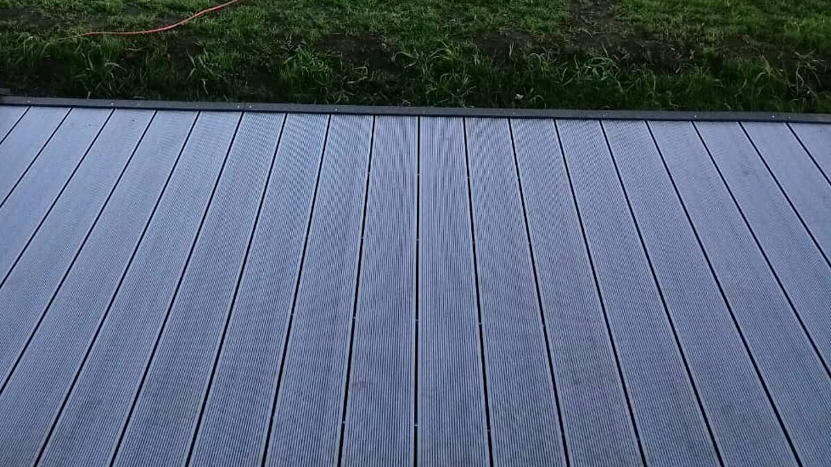 A house with a terrace – composite decking boards Standard Light Gray