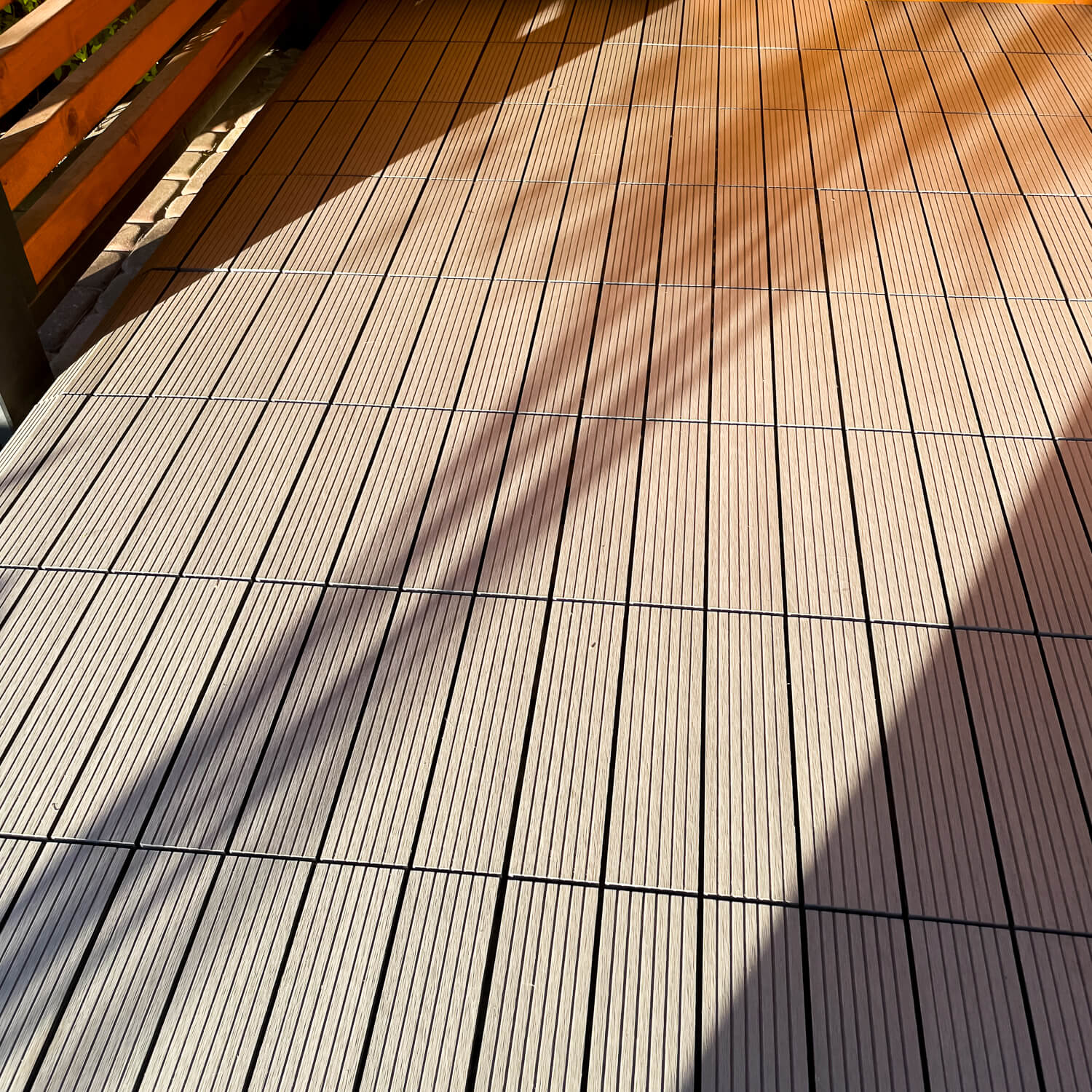 Terrace with Standard composite deck tiles in a grey shade