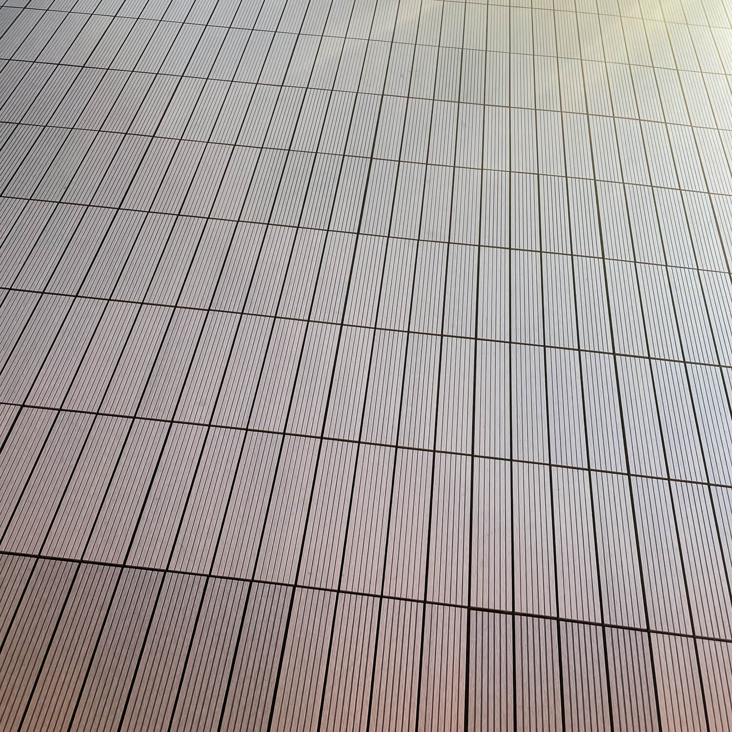 Terrace with Standard composite deck tiles in a grey shade