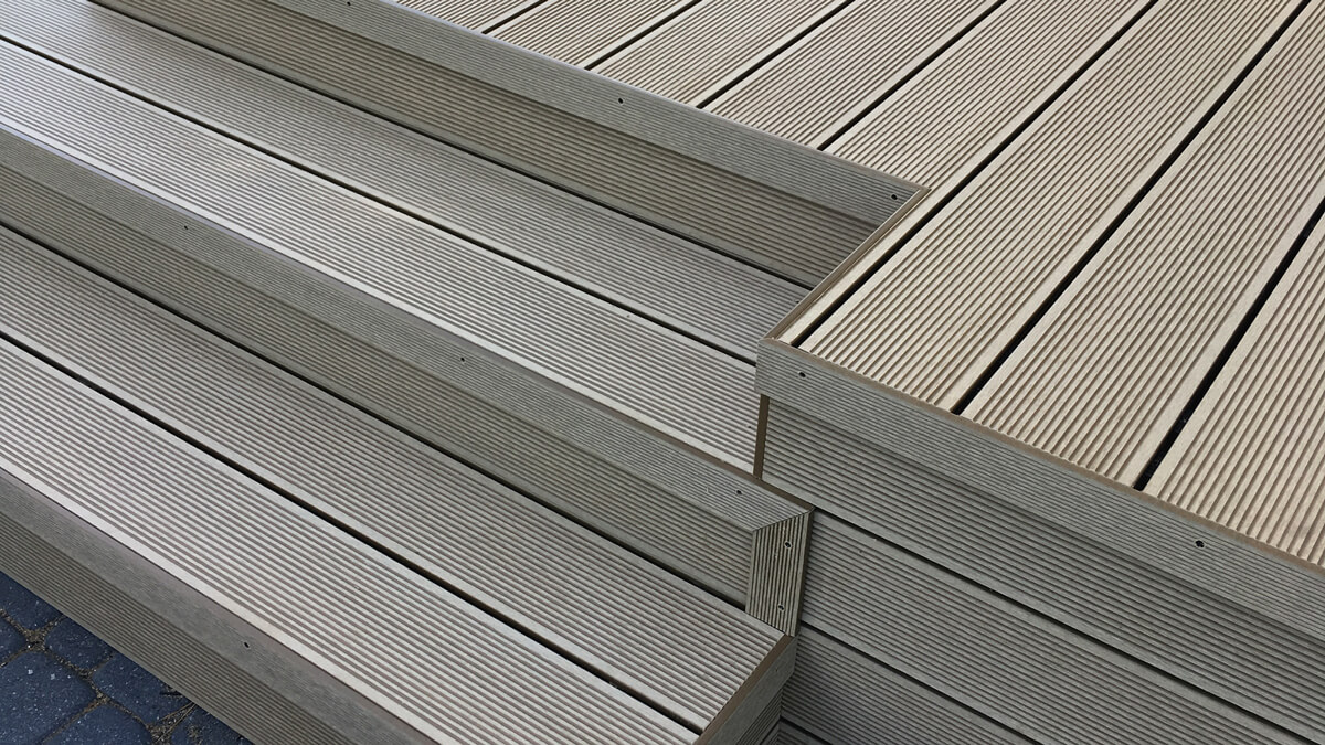 Stairs and high terrace made of WPC decking boards standard Honey Teak