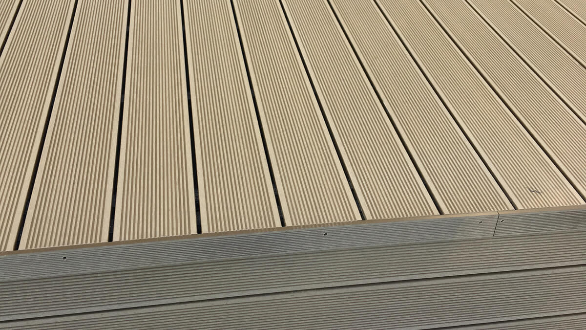 Stairs and high terrace made of WPC decking boards standard Honey Teak