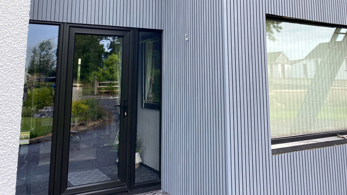 Entrance door cladding - composite slatted cladding boards Gray