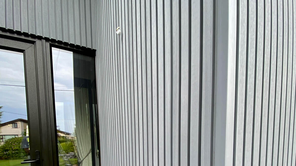 Entrance door cladding - composite slatted cladding boards Gray