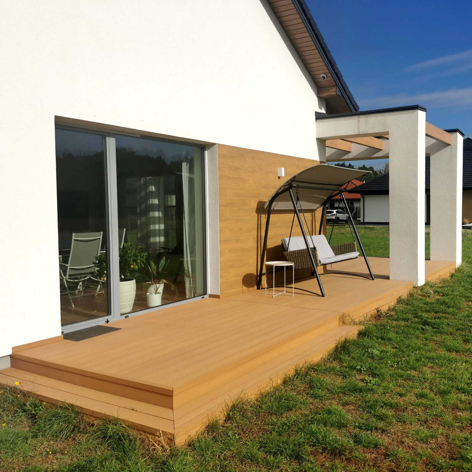 Terrace arrangement with Premium decking boards in Natural Oak shade