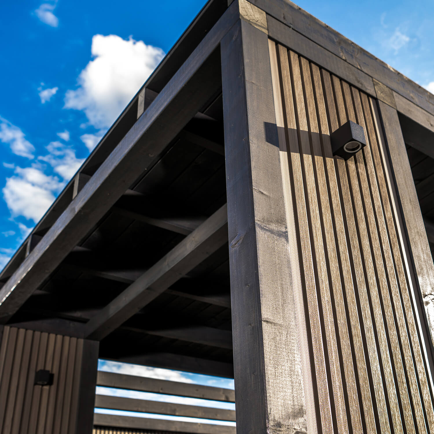 Roofed gazebo featuring Premium Slatted Cladding Boards in Antique Oak