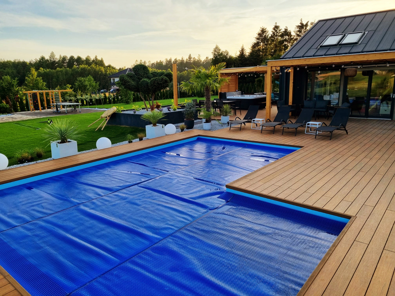 Luxury terrace made of Premium Amber composite decking with a pool