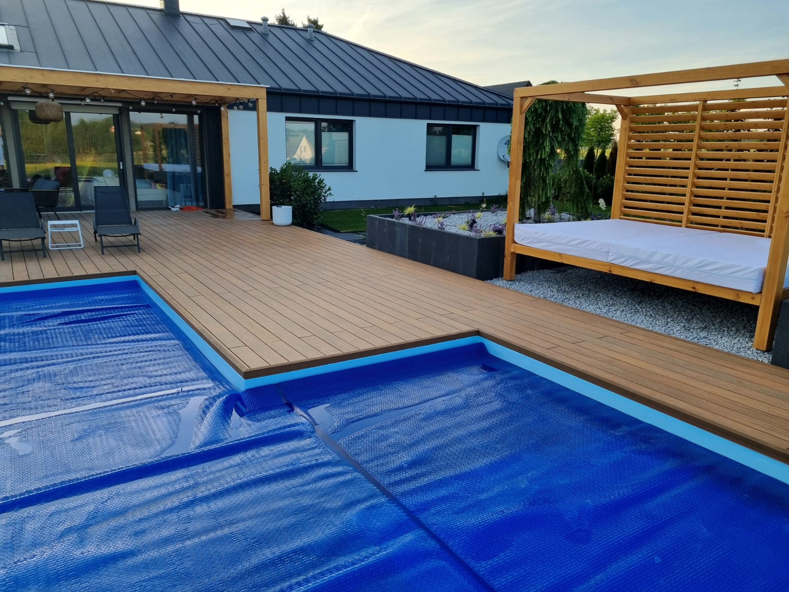 Luxury terrace made of Premium Amber composite decking with a pool
