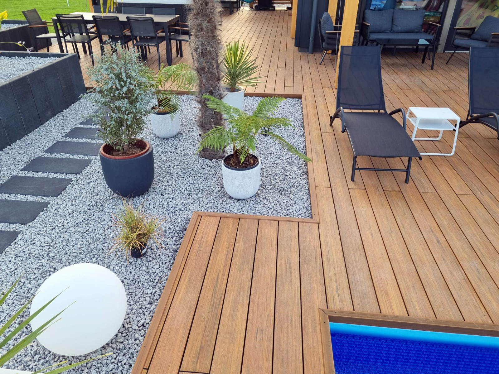 Luxury terrace made of Premium Amber composite decking with a pool