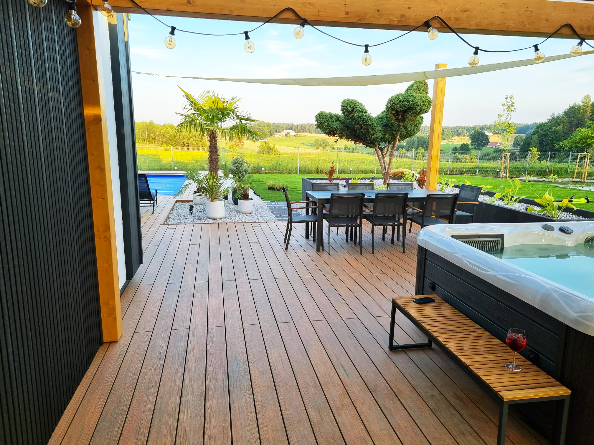 Luxury terrace made of Premium Amber composite decking with a pool