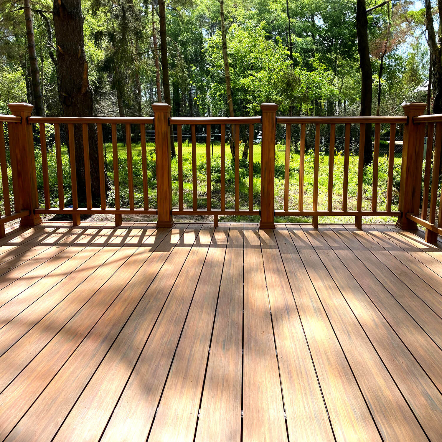 Brown terrace with composite railing – Amber Premium